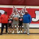 Mr. Johnson, his son and his grandsons modelling the new uniforms.